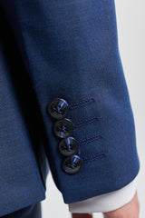 James meeste kolmeosaline tumesinine rätsepatööna valminud ülikond