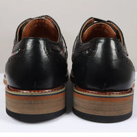 Ross - meeste mustad lillelise mustriga koljumustriga nahast brogue-kingad